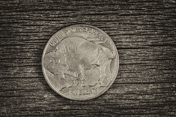 istock Buffalo Nickel on aged wood 470765928