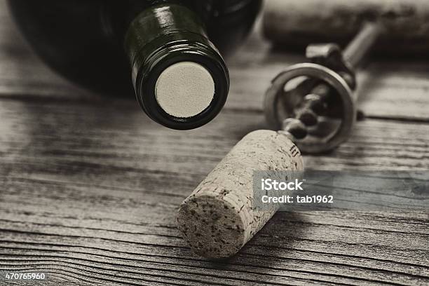 Vintage Bottle Of Wine Ready To Open On Aged Wood Stock Photo - Download Image Now - 2015, Alcohol - Drink, Bottle