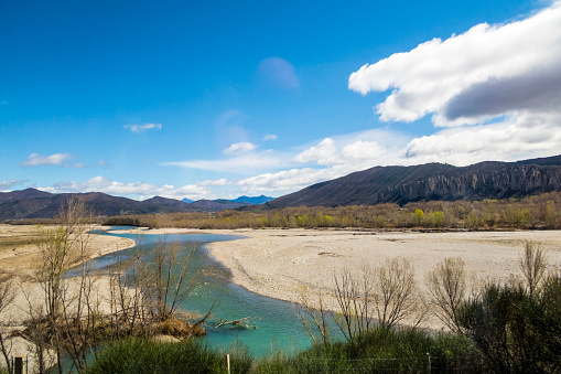 river near Digne les Bains in the Alps under blue sky