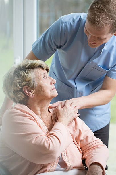 istock Male nurse caring about ill woman 470767152