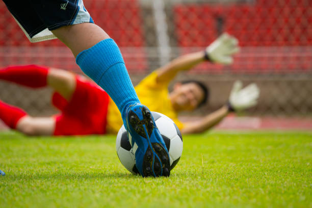 istock Attack soccer player shooting to defense team 470767414