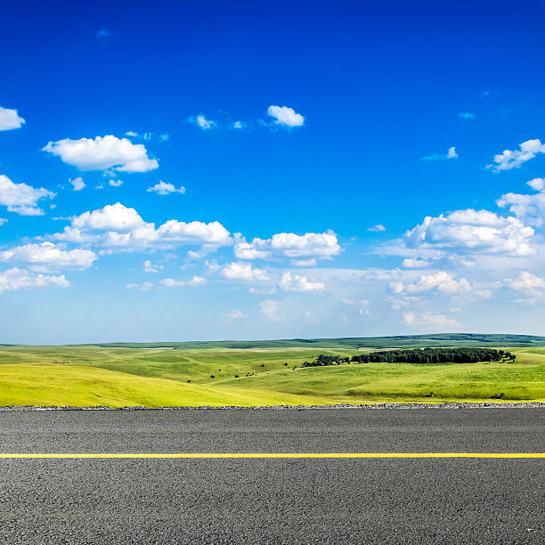 istock road in grassland 470767602