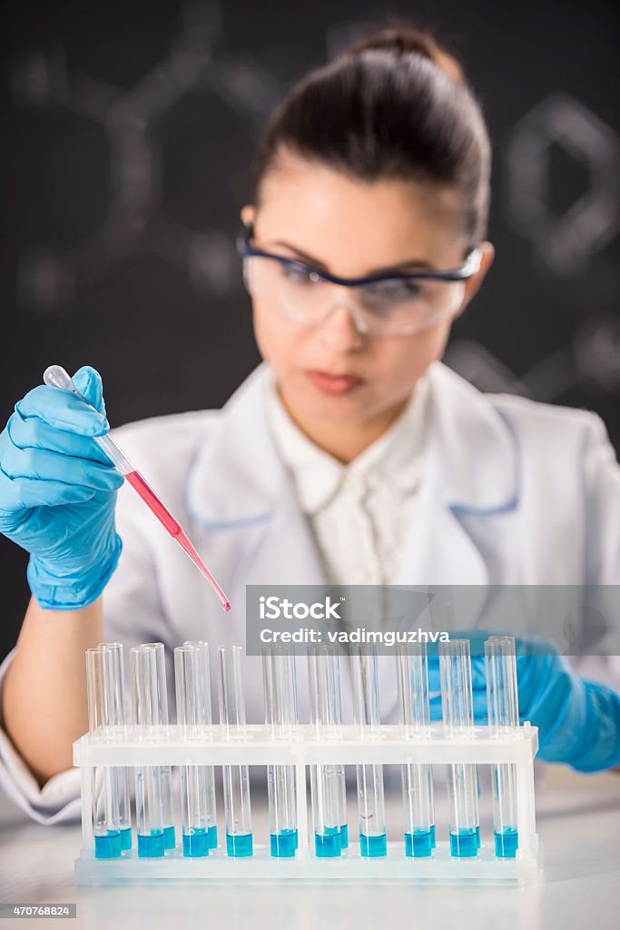 Laboratory Young brunette woman scientist researcher in the laboratory of the University 2015 Stock Photo