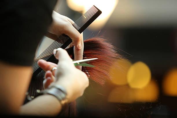 istock Barber cutting brown hair 470770031