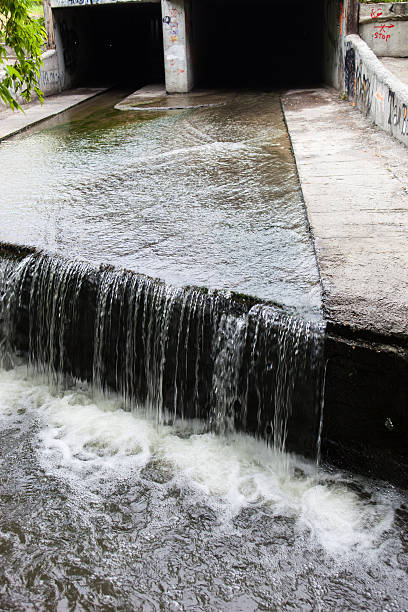istock Water stream flowing out the underground tunnel 470770032