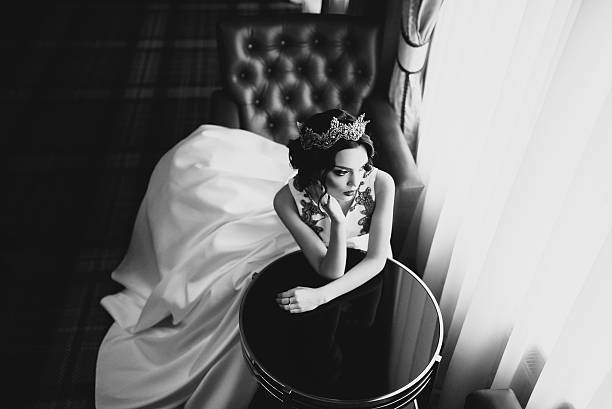 istock Black and white portrait of a bride sitting at a table 470770454