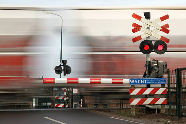 istock railway transport passing railroad crossing in holland 470773682