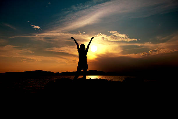 woman and sunset - Stock Image stock photo