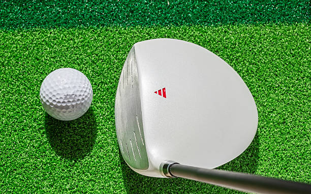 istock Golf club and golf ball on green grass background. 470774960