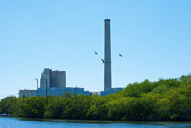 istock Power plant on a river with flying birds 470775142