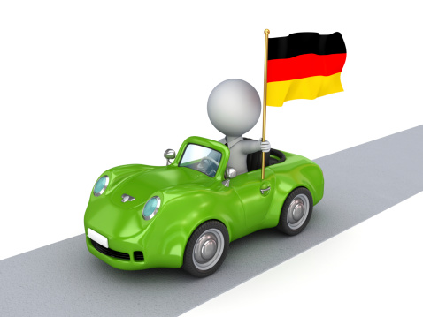 3d small person on green car with German flag.Isolated on white background.3d rendered.