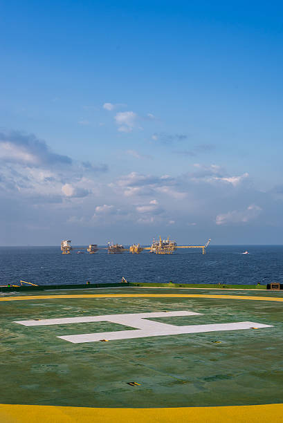istock Oil rig helipad and production platfrom in background 470777569