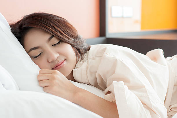 istock Asian woman lying and sleep on the bed 470778236