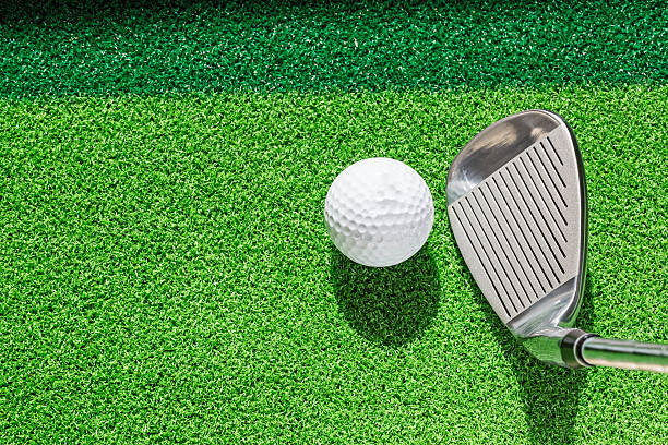 istock Golf club and golf ball on green grass background. 470778300