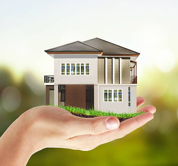 istock The house in human hands 470778898