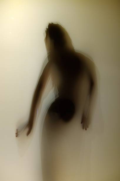 istock Shadow girl behind the transparent door 470779038
