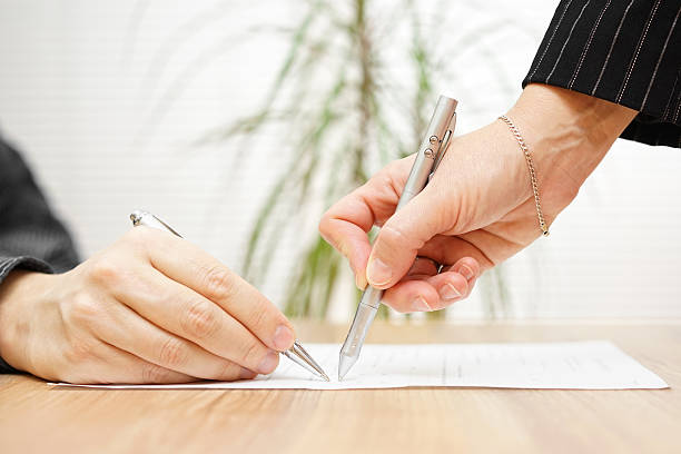 istock businessman and consultant discussing over  contract 470782502