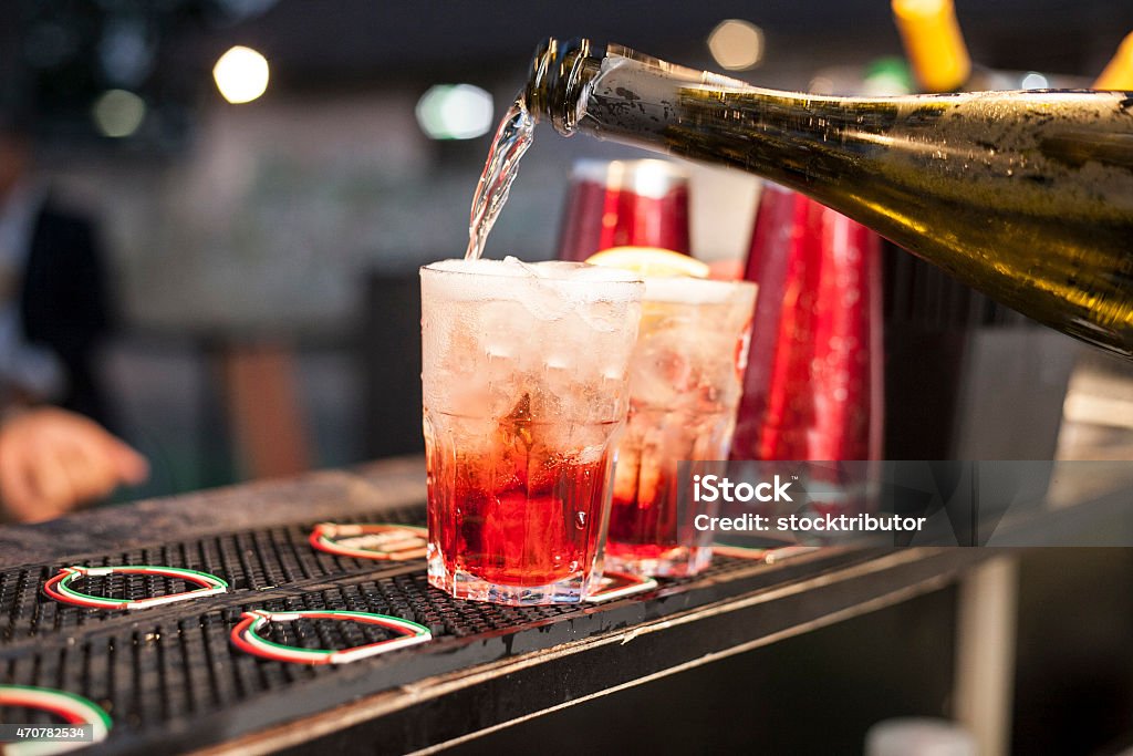 red cocktail bar with cool alcoholic cocktail with ice Campari Stock Photo