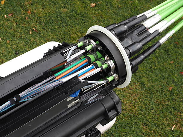 Fiber optic mass closure with cable entry ports Melbourne, Australia - April 19, 2015: Fibre optic mass closure with cable entry ports, National Broadband Network in Australia, a fast internet rollout covering most of Australia. broadband isp stock pictures, royalty-free photos & images