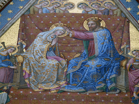 Coronation of the Virgin. One of the many mosaics on the facade of the cathedral in Orvieto , Umbria.