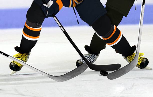 Ice Hockey players on rink stock photo