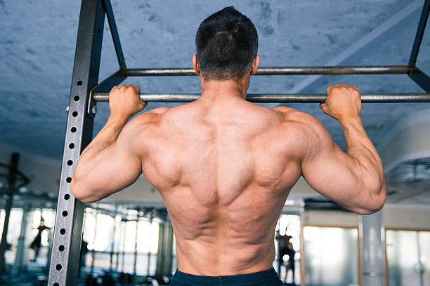 istock Back view portrait of a muscular man pulling up 470784262
