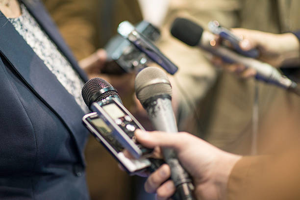istock Group of journalists interviewing female politician 470785222