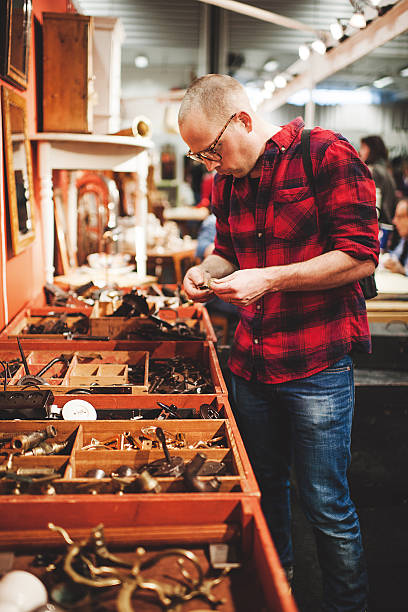istock Man in thrift shop - second hand store 470785873