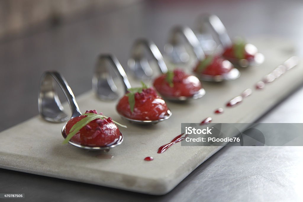 Strawberry soup spoons A spoon of strawberry soup Buffet Stock Photo