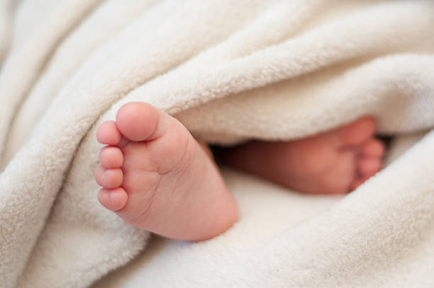 istock feet of a sleeping child 470788972