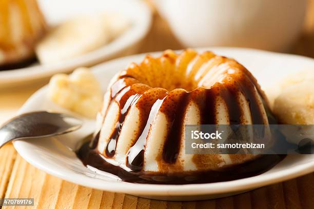 Vanilla Pudding Dessert With Chocolate Syrup And Banana Slices Stock Photo - Download Image Now