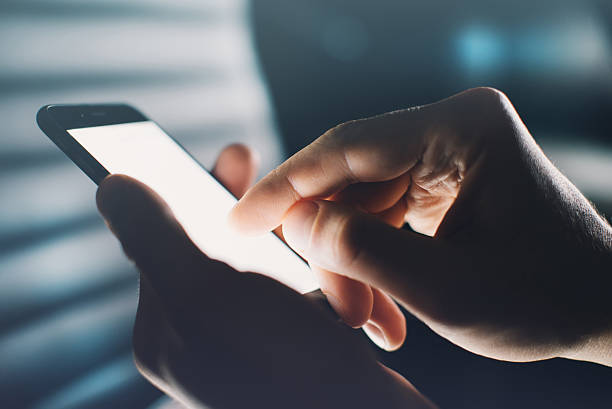 istock Closeup of hands using smartphone 470789772