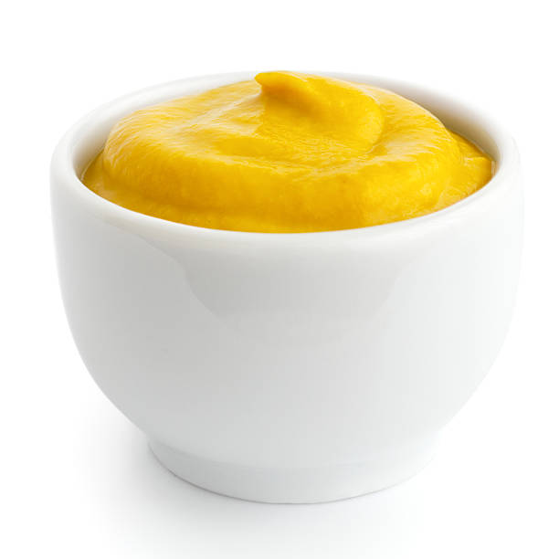istock A small white ceramic dish with yellow american mustard 470790122