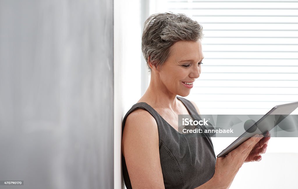 She's using technology to stay competitive A mature businesswoman using her digital tablet in the officehttp://195.154.178.81/DATA/i_collage/pu/shoots/785481.jpg 2015 Stock Photo