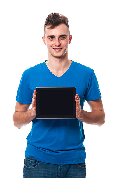 istock Young man showing screen of digital tablet 470792637