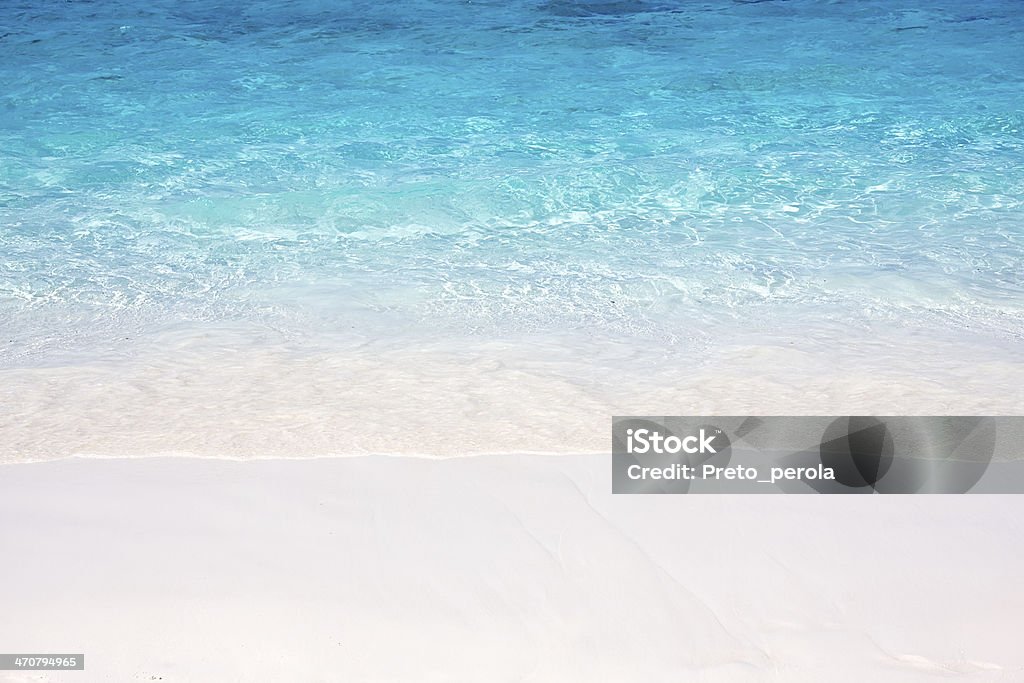 Wave of the sea on sand beach Wave of the sea on the sand beach Backgrounds Stock Photo