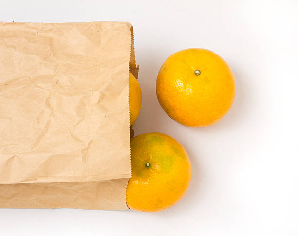 istock Oranges isolated in Brown paper bag 470795259
