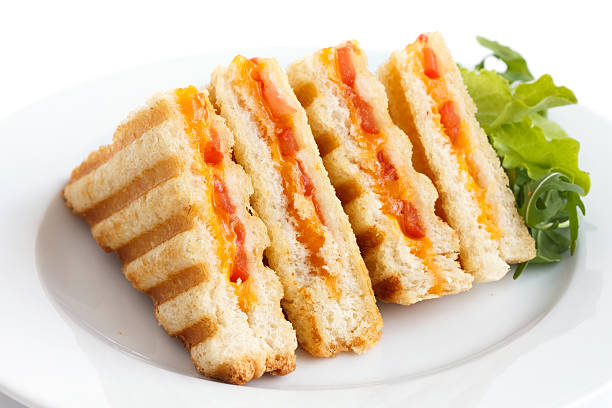 istock Classic tomato and cheese toasted sandwich on white plate. 470795334