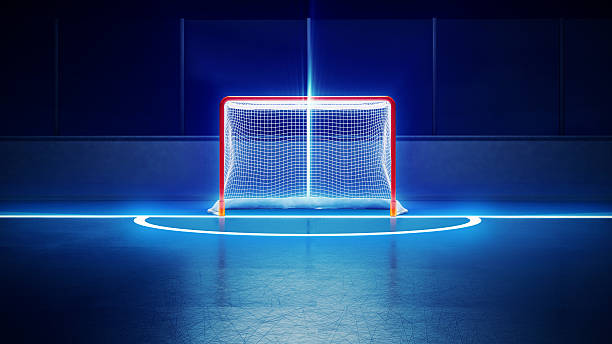 but de hockey sur la patinoire et - ice hockey hockey puck playing shooting at goal photos et images de collection