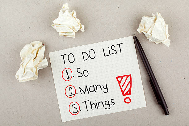To Do List So Many Things To do list with so many things note on paper with paper balls and pen managing stress stock pictures, royalty-free photos & images