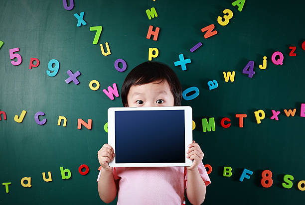 Boy with tablet Boy with tablet number magnet stock pictures, royalty-free photos & images