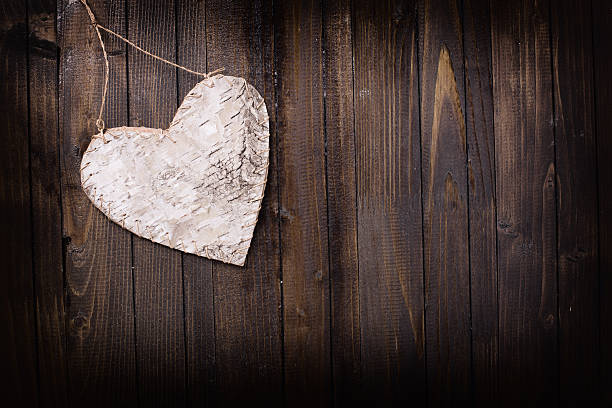 istock Heart on wooden background. 470801684