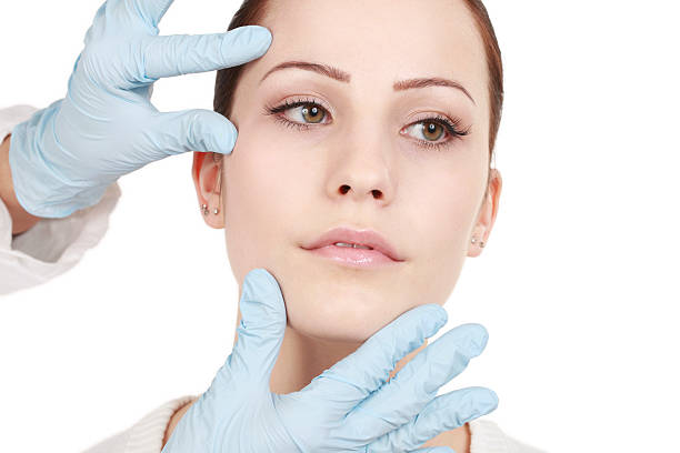 istock Attractive woman gets beauty treatment 470802240