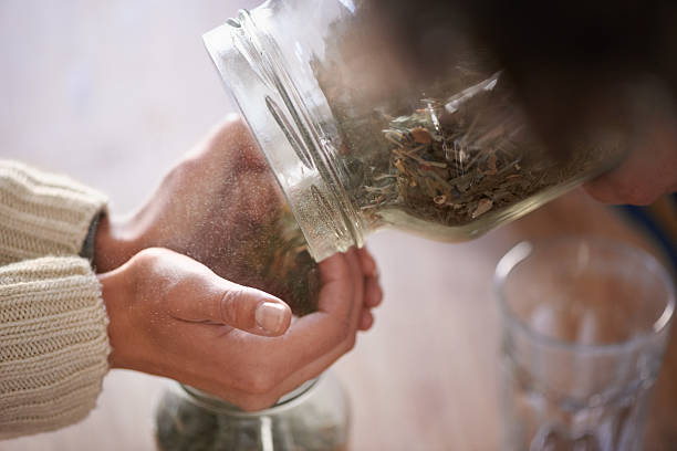 istock Putting tea leaves in jars 470802733