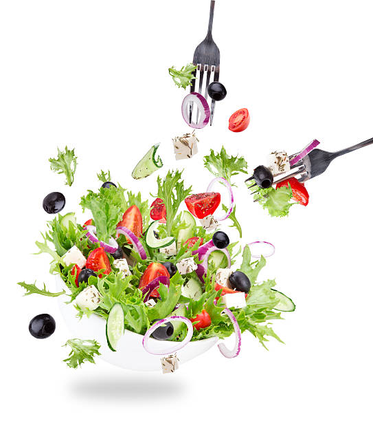 istock Fresh salad with flying vegetables ingredients 470802898