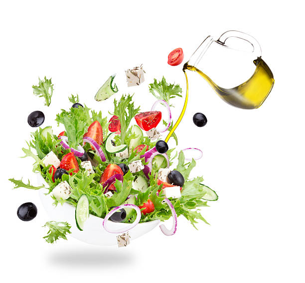 istock Fresh salad with flying vegetables ingredients 470802900