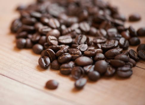 Shot of roasted coffee beans on a counter