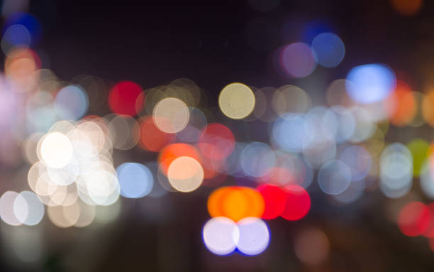 Moving cars with fast blurred trail of headlights stock photo