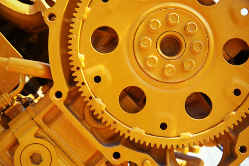 golden cogwheel gear. industrial machinery.