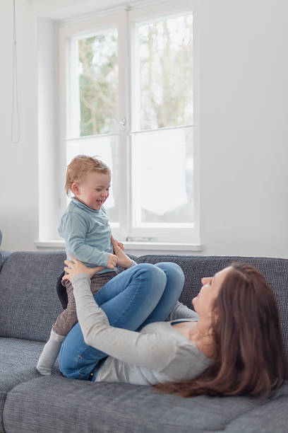 istock young mother play with baby 470806743
